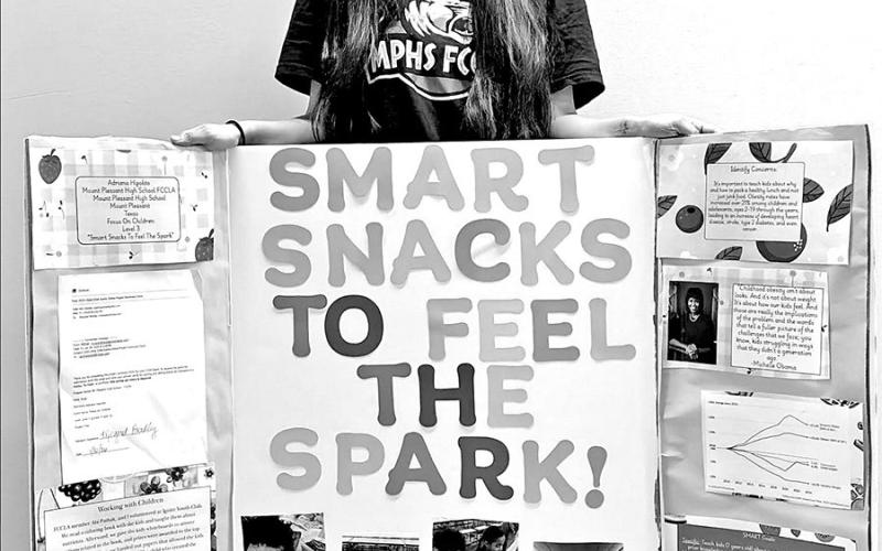 Adriana Hipolito with her project, Focus on Children Courtesy Photos