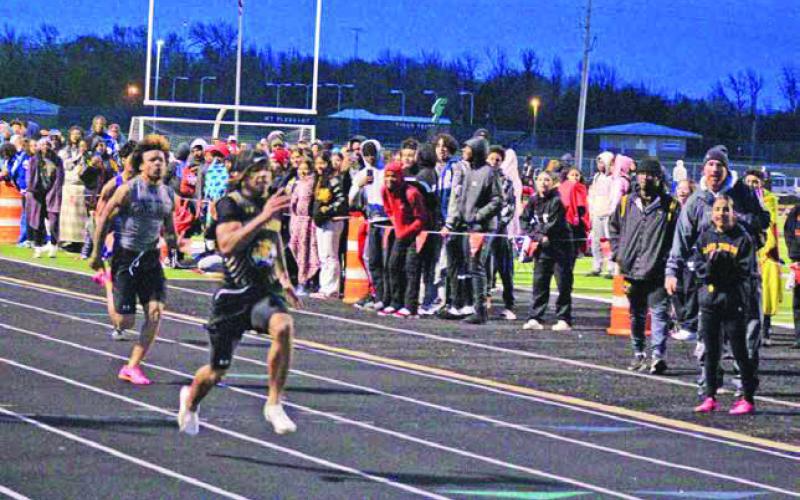 Mount Pleasant’s Dylan Bennett pulls away at the conclusion of the 100 meters at the Mount Pleasant Relays last week. Bennett ran a 10.92 to claim first in the event. TRIBUNE PHOTO / QUINTEN BOYD