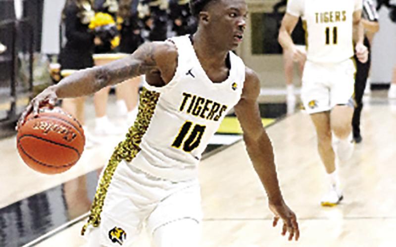 Tigers escape Hallsville 46-44, set win streak record