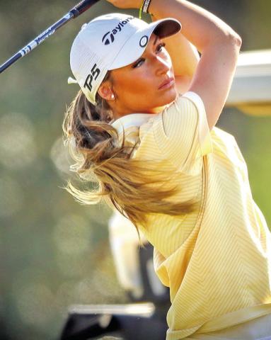 Kylee Strickland tees off during the district golf tournament, where she finished second to earn a spot in the Regional Tournament in April.