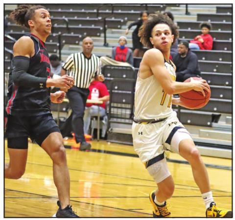 Payton Chism drives to the basket against Marshall. PHOTO BY JOHN WHITTEN