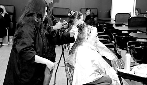 MPHS senior Aradeliz Alarcon cuts a client’s hair