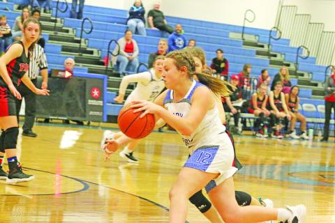 Alexis Case drives toward the basket for the Rivercrest Lady Rebels last Thursday. The Lady Rebels fell in their final two games of 2022 against Paris Warriors and Bloomburg.