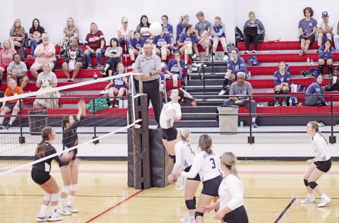 TRIBUNE PHOTO / QUINTEN BOYD Kynzie Franks jumps for a spike during tournament play at Hughes Springs last weekend. The Lady Rebels will play in the Hooks Tournament and on the road at Queen City this weekend.