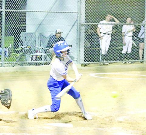 Rivercrest’s Abby Ross swings for what would be the game-winning hit Tuesday during the Lady Rebels’ game against Pittsburg. Ross hit the game-winning three RBI triple as the Lady Rebels won over the Lady Pirates in extra innings, 5-3. TRIBUNE PHOTO / QUINTEN BOYD