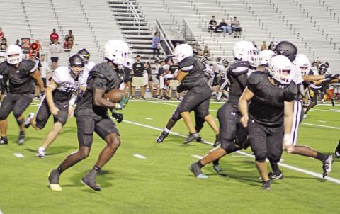 Running back Braylon Jones and the Mount Pleasant Tigers will open their season Friday against the Pittsburg Pirates in the Black and Gold Classic. TRIBUNE PHOTO / QUINTEN BOYD