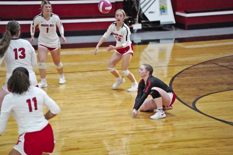 Chapel Hill’s Hannah Rhea drops to a knee for a dig during last Tuesday’s matchup against Quitman. The Lady Devils traveled to Harmony Friday and will host Mount Vernon Tuesday. COURTESY PHOTO