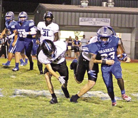 Pewitt’s Junie Johnson fights through tackles for a gain during Friday’s game against Redwater. The Brahmas will travel to DeKalb Friday evening. BEE PHOTO / QUINTEN BOYD