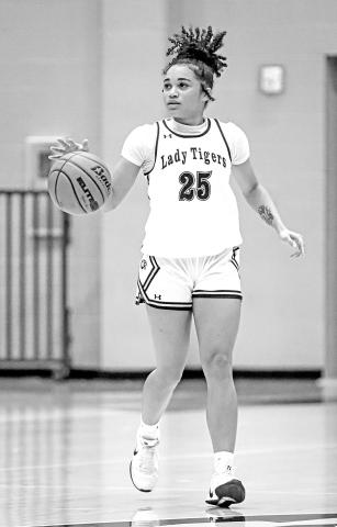 Kaylin Brannon brings the ball up for the Lady Tigers vs Hallsville. Brannon finished with 22 points for the Lady Tigers.