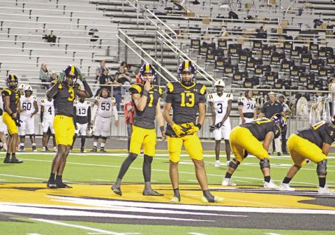 From left, Kevi Heath, Braylon Jones, Mason McMinn and Kyler Smith look to the sidelines to receive a play call during a recent game. Mount Pleasant will host Pine Tree Friday at Sam Parker Field, needing two wins to keep their playoff hopes alive. TRIBUNE PHOTO / QUINTEN BOYD