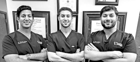 Dr. Husban Shahid (middle) joins his brothers at Pleasant Smiles Dental