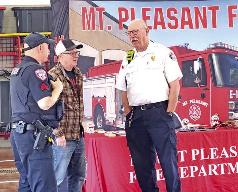 Mt. Pleasant fire chief and police chief visit during the free pancake breakfast TRIBUNE PHOTO / NICOLE KIMBALL