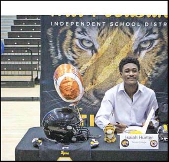 COURTESY PHOTO Months after suffering an injury during Mount Pleasant’s game against Frisco Emerson, Tiger Isaiah Hunter signed his letter of intent to play football at Texas College. The Steers are part of the Red River Athletic Conference of NAIA and finished last season 1-10.