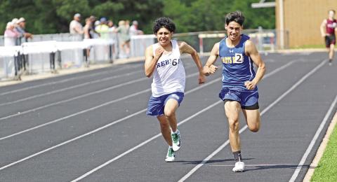 Rivercrest’s Joseph Roquez and Harts Bluff’s Johnathan Diaz race to the finish line during the varsity boys’ 800 meter run Wednesday afternoon. Both will advance to the area track meet; Roquez finished second and Diaz finished third.