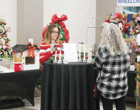 Titus Regional Medical Center’s annual “All is Bright” event was held Thursday evening. Holiday decor items, like trees, wreaths and stockings, were up for grabs in a silent auction. After bidding ended, a ceremony with music, prayer and a memorial candle lighting took place.