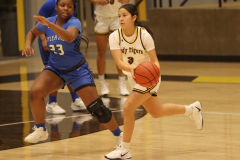 Melany Morales drives the lane against the Lady Lions.  Morales led all scorers with 21 points including six from long range.