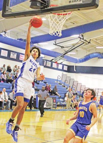 Rivercrest’s Kamryn WIlliams hits the skies for a layup during last week’s game against James Bowie. TRIBUNE PHOTO / QUINTEN BOYD