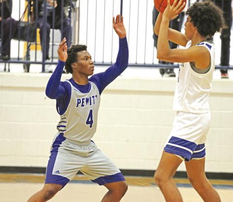 Pewitt’s Miyon Flemming guards Rivercrest’s Tre Williams during Friday’s game. The Rebels defeated the Brahmas, 6144. TRIBUNE PHOTO / QUINTEN BOYD