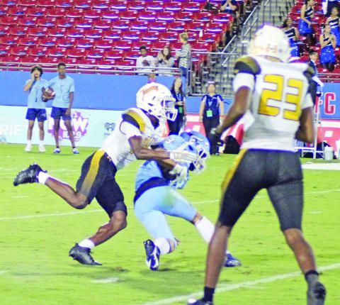 Xavier Hills brings down a ball carrier while teammate Antez Jeffrey backs up the play during a recent game. Mount Pleasant will return to Sam Parker Field for Homecoming Friday against Nacogdoches. TRIBUNE PHOTO / QUINTEN BOYD