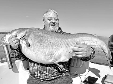 Kevin Williford of Woodville made a trip to Lake Tawakoni in mid-March with high hopes of reeling in a blue catfish heavier than the 72 pounder he caught there seven years ago. Fishing guide Michael Littlejohn delivered the goods by putting the angler on this 74.5 pounder. The fat cat ate a big slab of fresh carp Williford was drifting over an underwater point in about 18 feet of water. (Courtesy Photo)