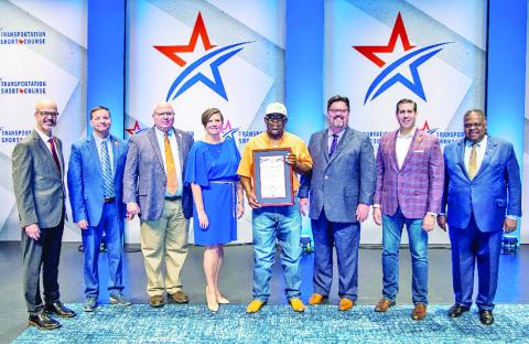 From left: TxDOT Executive Director Marc Williams, TxDOT Chief Engineer Lance Simmons, TxDOT Deputy Executive Directors Brian Barth &amp; Brandye Hendrickson, Extra Mile Award recipient Elton Bolden, Texas Transportation Commissioner W. Alvin New, Texas Transportation Commissioner Alejandro “Alex” G. Meade III and Texas A&amp;M Board of Regents Chairman Bill Mahomes COURTESY PHOTOS