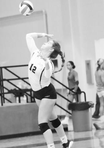Senior Hadleigh Mays serves the ball. COURTESY PHOTO / JOHN WHITTEN