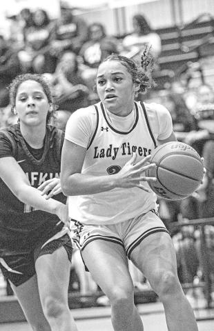 Kaylin Brannon attacks the paint in the :Lady Tiger win against Lufkin.
