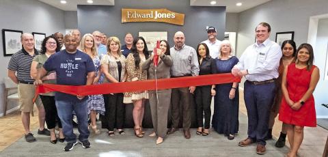 The red ribbon was cut to celebrate the finished renovations for Edward Jones