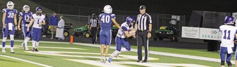 Zane Dees powers his way past Jordan Mojica for Rivercrest’s touchdown in their playoff game Thursday against Beckville at Longview’s Lobo Stadium. TRIBUNE PHOTO / QUINTEN BOYD
