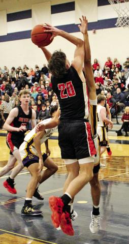Chapel Hill’s Max Daniel (20) goes up for a short jumper against Edgewood last week. COURTESY PHOTOS / JAMES WATSON