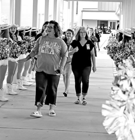 MPISD staff members are greeted by the MPHS Tiger Dolls as they enter the auditorium.