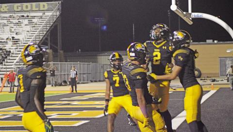 From left, Braylon Jones, Kevi Heath, Kyler Smith, Dylan Bennett and Payton Chism celebrate Chism’s second quarter touchdown that would give Mount Pleasant a lead they would not relinquish in their Homecoming win over Nacogdoches. The Tigers won, 45-13. TRIBUNE PHOTO / QUINTEN BOYD