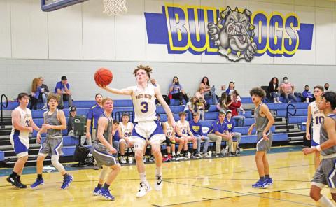 Ashyr Carrington soars to the basket during last week’s game against Yantis.