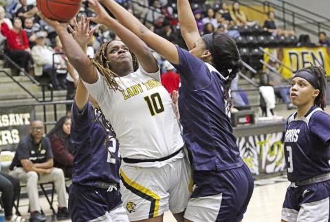 Jordyn Hargrave battles through the Paris defense for a layup during Tuesday’s game. The Lady Tigers remained undefeated on the season with a 56-25 win over the Ladycats. TRIBUNE PHOTO / QUINTEN BOYD