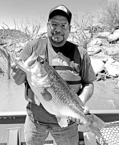 Ross Gomez with the the 13.22 pound Toyota ShareLunker he caught while fishing from the public dock at Sam Wahl Recreation Area on Lake Alan Henry in February 2023. The fish produced nearly 34,000 fingerlings during its brief stay at the TFFC and was released back into Alan Henry the following April. (TPWD Photo)
