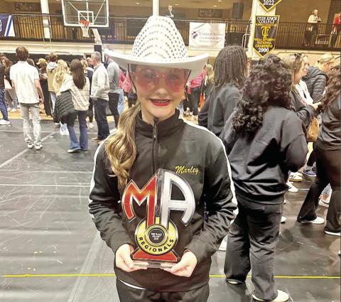 Marley Broach with her solo award