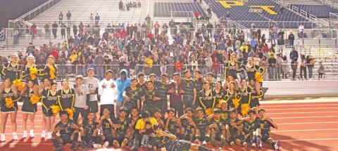 The Mount Pleasant soccer team celebrates with the fans and cheerleaders after their regional quarterfinal victory over Whitehouse Friday.