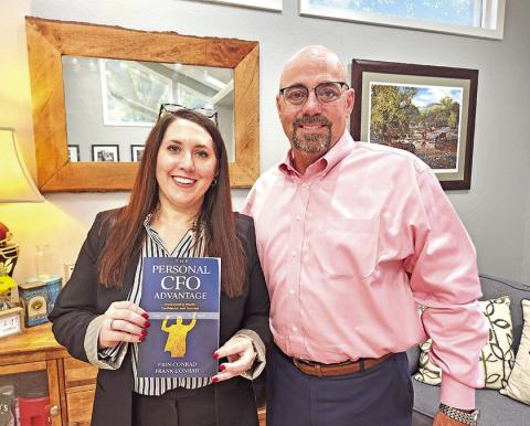 Erin and Frank Conrad with their brand new book, The Personal CFO Advantage