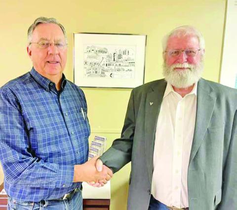 Pastor Mark McClanahan of Tennison Memorial United Methodist Church announced the new Chairman of the Board of Trustees. New Chairman Jerry Hearron (left) receives best wishes from outgoing chairman Read Pearson (right.) COURTESY PHOTO