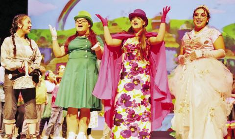 Dorothy (Madison Zepeda, left) is welcomed to Munchkin Land by (L to R) Ensemble member (Danika Beckham), Leader of the Winkie Guards (Emma Sanders) and Glinda the Good Witch (Gracie Martinez) COURTESY PHOTO