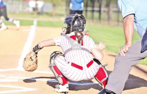 Hannah Rhea catches a pitch during Chapel Hill’s game against Quitman. The Lady Red Devils defeated the Lady Bulldogs, 3-1. COURTESY PHOTO