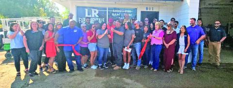LR Fab & Rentals celebrate the snip of their red ribbon