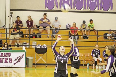 CHAAMP’s Tymber Reust prepares to set the ball while Emma Anderson (back) and Marie Glanzer (front) advance toward the net. The Lady Hawks went 2-2 in their last four games with wins over Tyler King’s Academy and Tyler HEAT. TRIBUNE PHOTO / QUINTEN BOYD