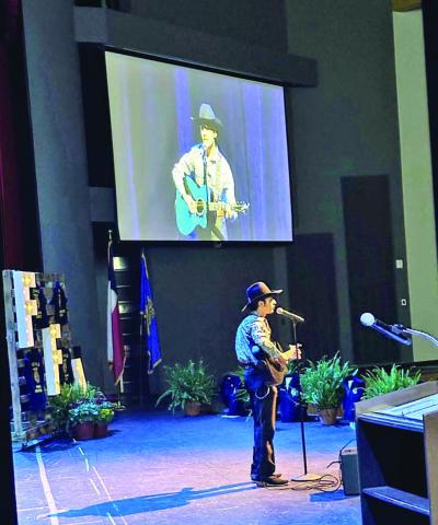 Christo Escalante performs for the members
