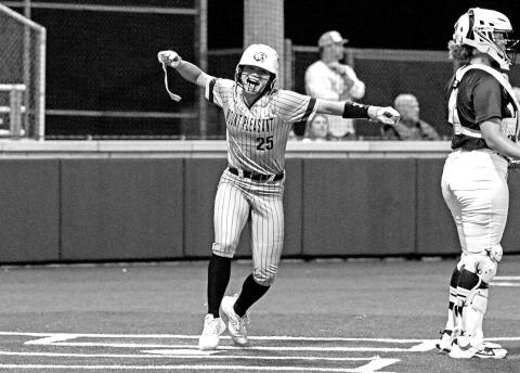 KK Brannon celebrates after connecting with the first pitch of the series and scoring on an inside the park homerun.