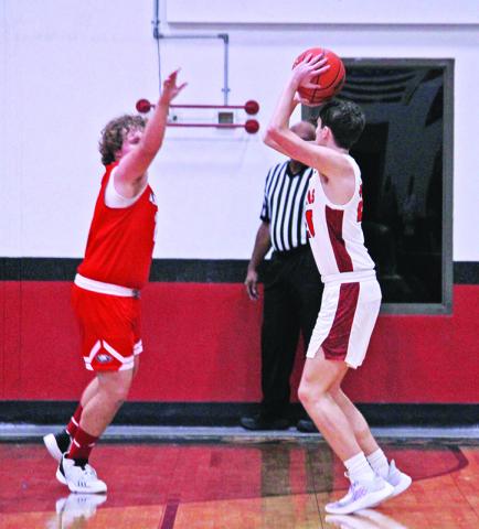 Max Daniel hoists a shot during Tuesday’s game. The eighth-ranked Chapel Hill Red Devils eased past Harmony, 82-36.