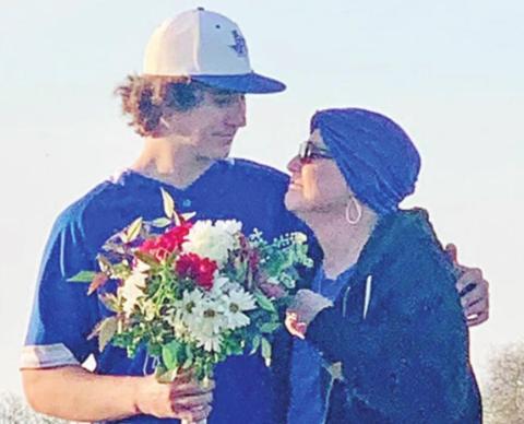 Pewitt pitcher Dayton Granberry embraces his mother, Rachael, prior to Friday’s game. The Brahmas honored Rachael Granberry, who is battling breast cancer. Following the ceremony, Dayton Granberry pitched a one-hitter with 10 strikeouts and added two hits, three RBIs and two runs scored in the Brahmas’ 20-1 win. COURTESY PHOTO