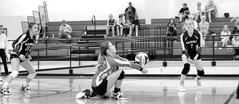 E. Hulen digs a ball at Hughes Springs COURTESY PHOTO / JOSUE CONTRERAS
