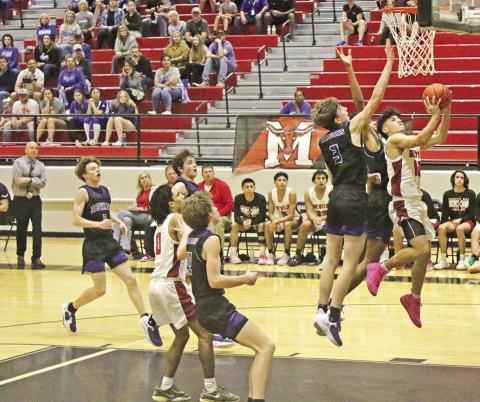 Chapel Hill’s Adrian Ramirez drives for a layup during Tuesday’s bidistrict game against Redwater. The Red Devils took on Jefferson in Friday’s area round game. TRIBUNE PHOTO / RYLEIGH STEGALL