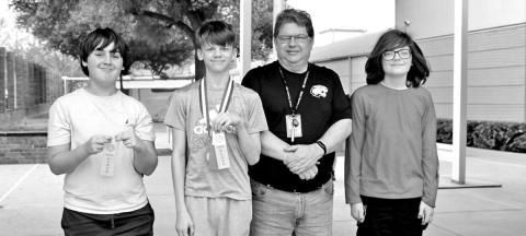 Calculator (L to R) Tristan Kirkland, Macon Bradshaw, Coach Terry Fitch, JC Moss